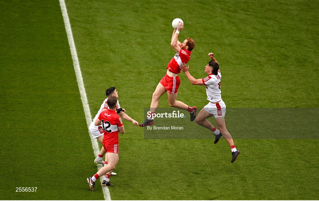 2 July 2023; Conor Glass of Derry fields a kickout ahead of Colm O'Callaghan of Cork during the GAA Football All-Ireland Senior Championship quarter-final match between Derry and Cork at Croke Park in Dublin. Photo by Brendan Moran/Sportsfile