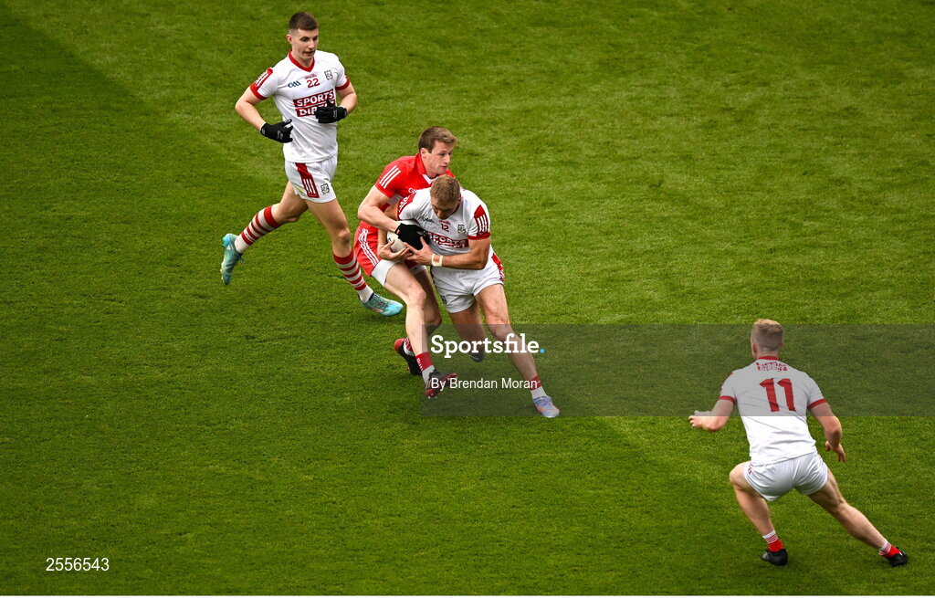 2 July 2023; Killian O'Hanlon of Cork dispossesses Brendan Rogers of Derry for a turnover during the GAA Football All-Ireland Senior Championship quarter-final match between Derry and Cork at Croke Park in Dublin. Photo by Brendan Moran/Sportsfile