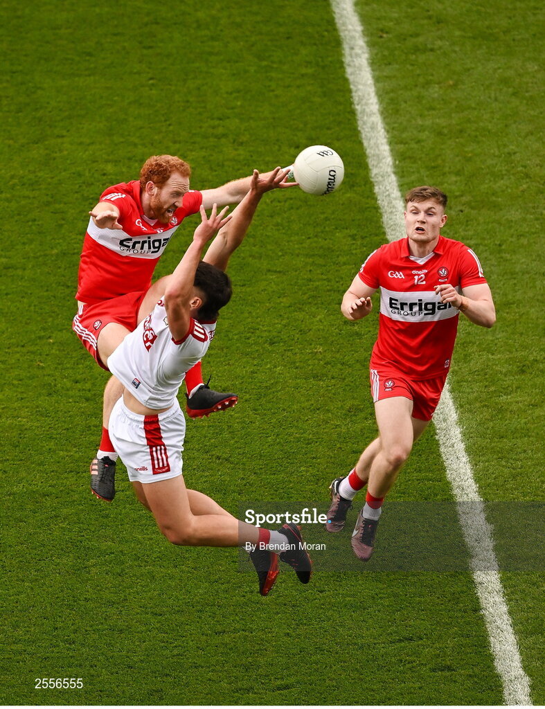 2 July 2023; Colm O'Callaghan of Cork and Conor Glass of Derry contest a high ball during the GAA Football All-Ireland Senior Championship quarter-final match between Derry and Cork at Croke Park in Dublin. Photo by Brendan Moran/Sportsfile