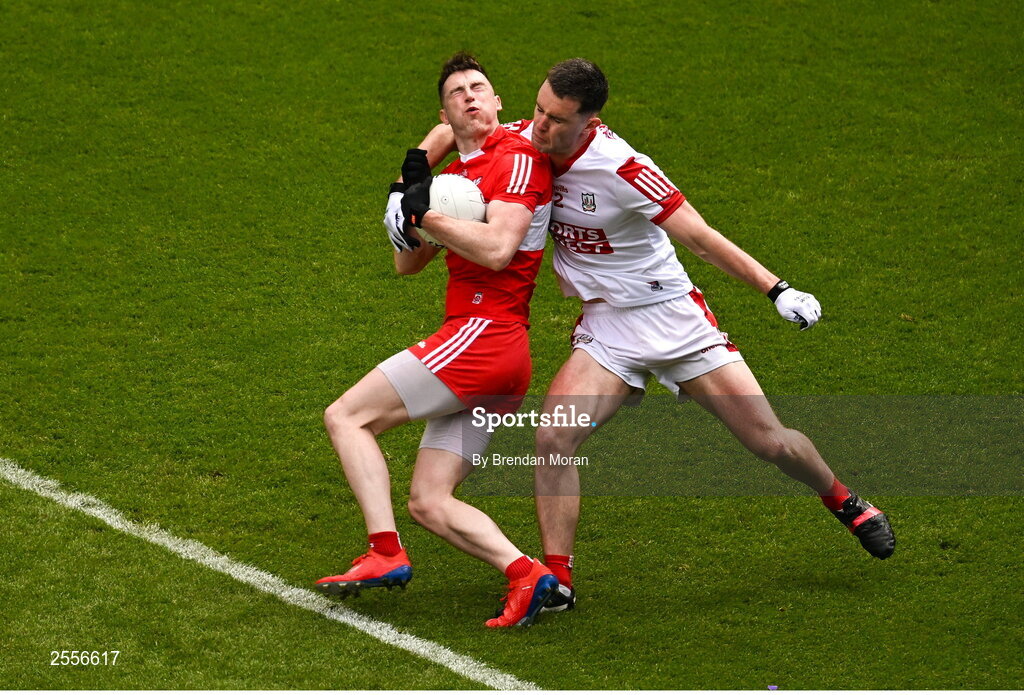 2 July 2023; Gareth McKinless of Derry is tackled by Maurice Shanley of Cork during the GAA Football All-Ireland Senior Championship quarter-final match between Derry and Cork at Croke Park in Dublin. Photo by Brendan Moran/Sportsfile