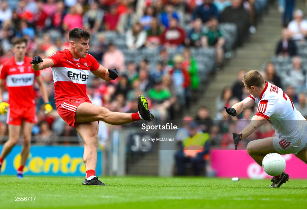 2 July 2023; Conor Doherty of Derry shoots past Matty Taylor of Cork to score a goal, in the 49th minute, during the GAA Football All-Ireland Senior Championship quarter-final match between Derry and Cork at Croke Park in Dublin. Photo by Ray McManus/Sportsfile
