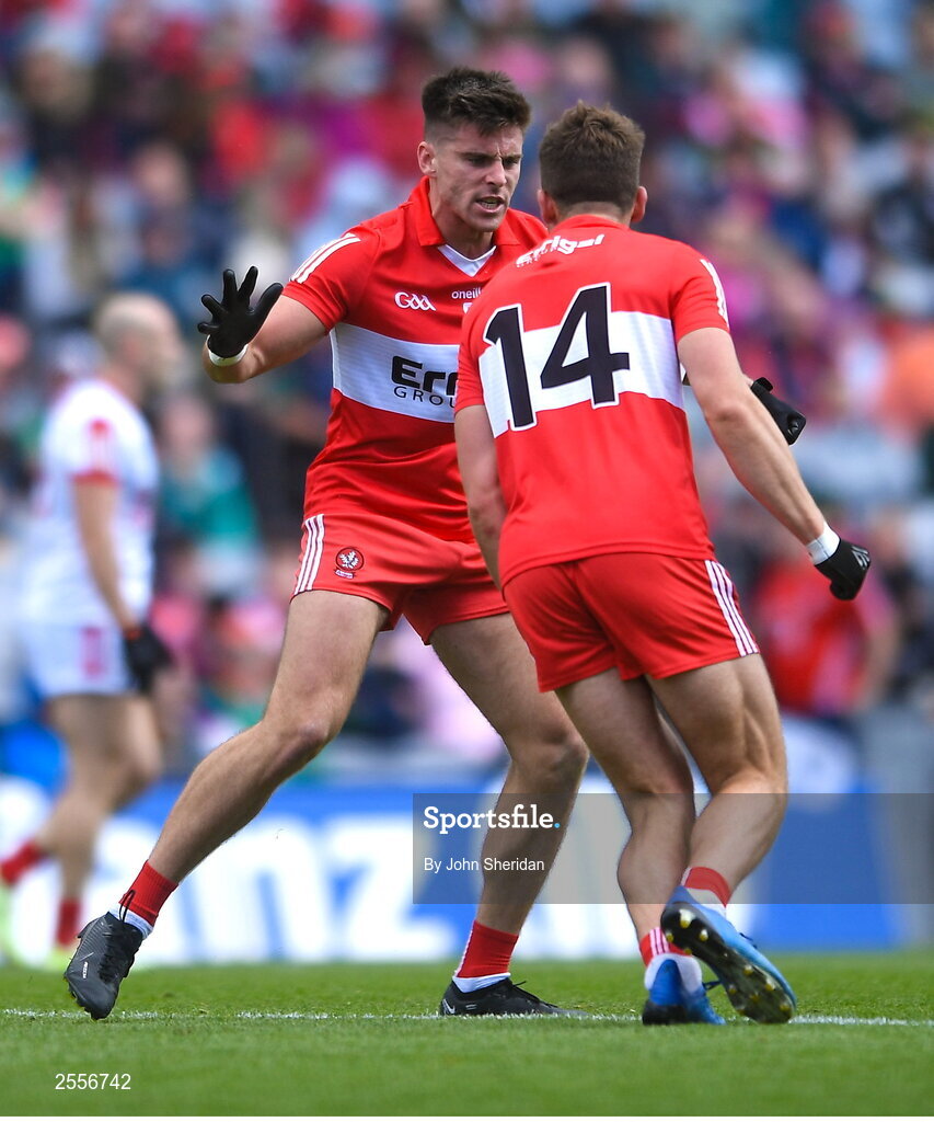 2 July 2023; Conor Doherty of Derry celebrates with teamate Shane McGuigan after scoring his side's first goal during the GAA Football All-Ireland Senior Championship quarter-final match between Derry and Cork at Croke Park in Dublin. Photo by John Sheridan/Sportsfile