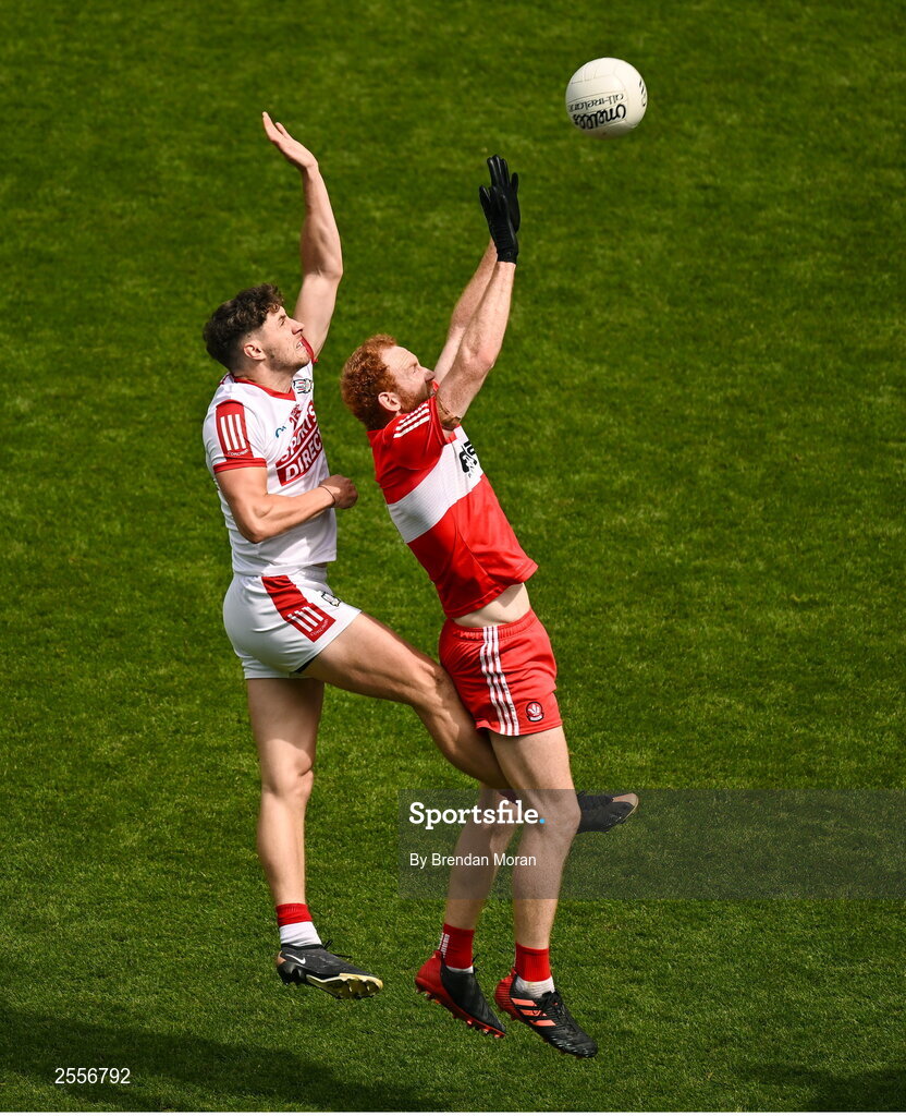 2 July 2023; Conor Glass of Derry and Paul Walsh of Cork contest a kickout during the GAA Football All-Ireland Senior Championship quarter-final match between Derry and Cork at Croke Park in Dublin. Photo by Brendan Moran/Sportsfile