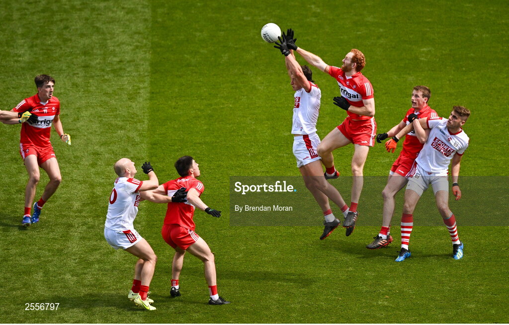 2 July 2023; Conor Glass of Derry and Colm O'Callaghan of Cork contest a kickout during the GAA Football All-Ireland Senior Championship quarter-final match between Derry and Cork at Croke Park in Dublin. Photo by Brendan Moran/Sportsfile
