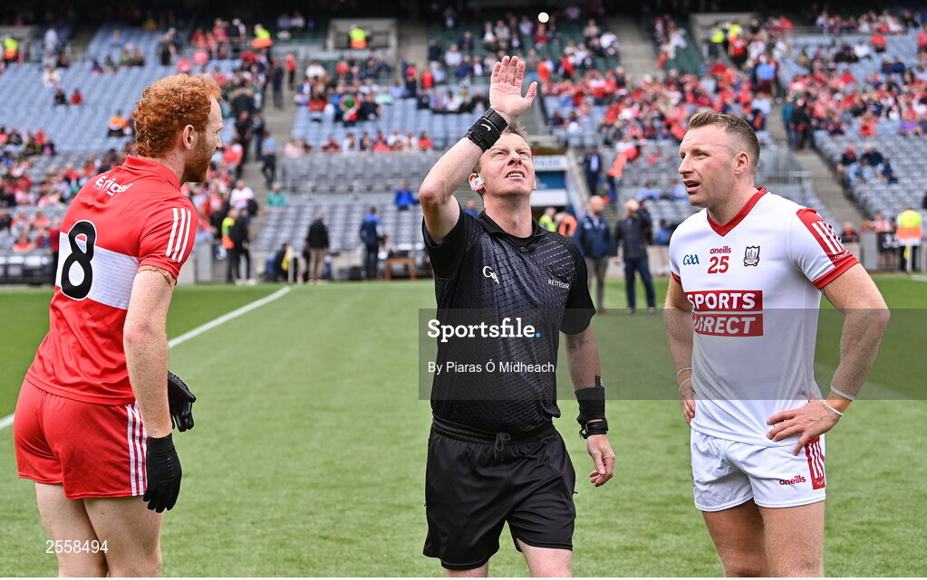 2 July 2023; Referee Joe McQuillan with team captains Conor Glass of Derry and Brian Hurley of Cork for the coin toss before the GAA Football All-Ireland Senior Championship quarter-final match between Derry and Cork at Croke Park in Dublin. Photo by Piaras Ó Mídheach/Sportsfile