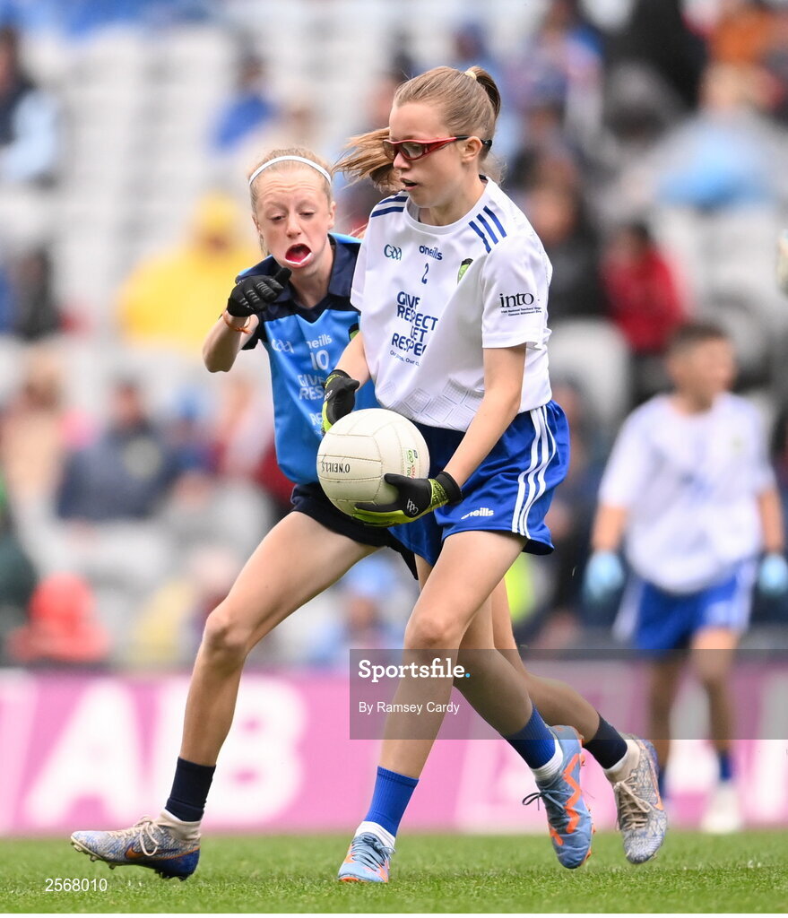 15 July 2023; Emily Nic an tSaoir, Gaelscoil Eoghain Uí Thuairisc, Carlow, representing Monaghan, and Ava Moll Lyons, Bornacoola NS, Carrick-on-Shannon, Leitrim, representing Dublin, during the INTO Cumann na mBunscol GAA Respect Exhibition Go Games at the GAA Football All-Ireland Senior Championship semi-final match between Dublin and Monaghan at Croke Park in Dublin. Photo by Ramsey Cardy/Sportsfile
