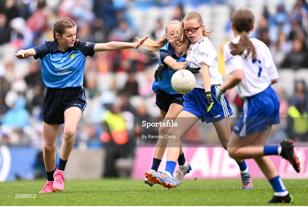 15 July 2023; Emily Nic an tSaoir, Gaelscoil Eoghain Uí Thuairisc, Carlow, representing Monaghan, and Ava Moll Lyons, Bornacoola NS, Carrick-on-Shannon, Leitrim, representing Dublin, during the INTO Cumann na mBunscol GAA Respect Exhibition Go Games at the GAA Football All-Ireland Senior Championship semi-final match between Dublin and Monaghan at Croke Park in Dublin. Photo by Ramsey Cardy/Sportsfile