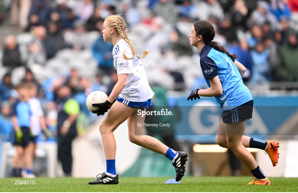 15 July 2023; Nell Kinsella, Glandore NS, Glandore, Cork, representing Monaghan, and Zoe Byrne, Clongeen NS, Foulkesmills, Wexford, representing Dublin, during the INTO Cumann na mBunscol GAA Respect Exhibition Go Games at the GAA Football All-Ireland Senior Championship semi-final match between Dublin and Monaghan at Croke Park in Dublin. Photo by Ramsey Cardy/Sportsfile