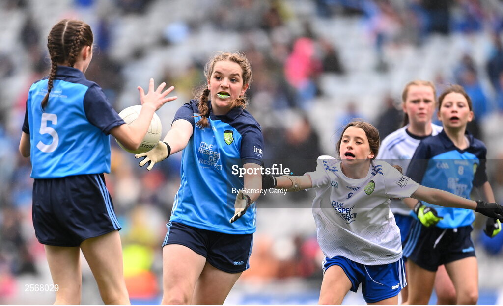 15 July 2023; Sorcha Aspell, Ardnagrath NS, Athlone, Westmeath, representing Dublin, and Cara McVeigh, Laghey PS, Dungannon, Tyrone, representing Monaghan, during the INTO Cumann na mBunscol GAA Respect Exhibition Go Games at the GAA Football All-Ireland Senior Championship semi-final match between Dublin and Monaghan at Croke Park in Dublin. Photo by Ramsey Cardy/Sportsfile