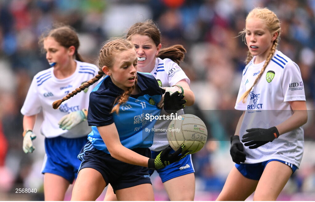 15 July 2023; Chloe Carey, Lisnagry NS, Lisnagry, Limerick, representing Dublin, and Lara McAleer, St. Mary's PS, Cabragh, Tyrone, representing Monaghan, during the INTO Cumann na mBunscol GAA Respect Exhibition Go Games at the GAA Football All-Ireland Senior Championship semi-final match between Dublin and Monaghan at Croke Park in Dublin. Photo by Ramsey Cardy/Sportsfile