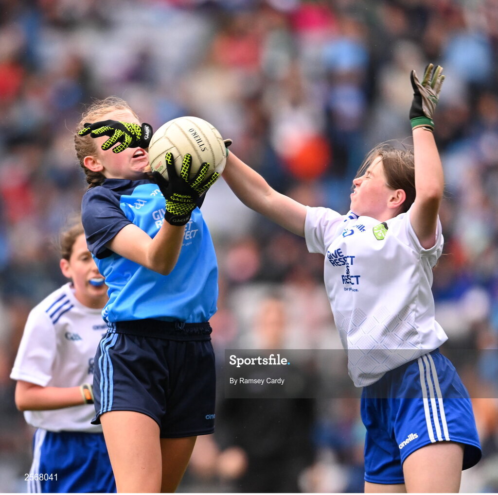 15 July 2023; Chloe Carey, Lisnagry NS, Lisnagry, Limerick, representing Dublin, and Lara McAleer, St. Mary's PS, Cabragh, Tyrone, representing Monaghan, during the INTO Cumann na mBunscol GAA Respect Exhibition Go Games at the GAA Football All-Ireland Senior Championship semi-final match between Dublin and Monaghan at Croke Park in Dublin. Photo by Ramsey Cardy/Sportsfile