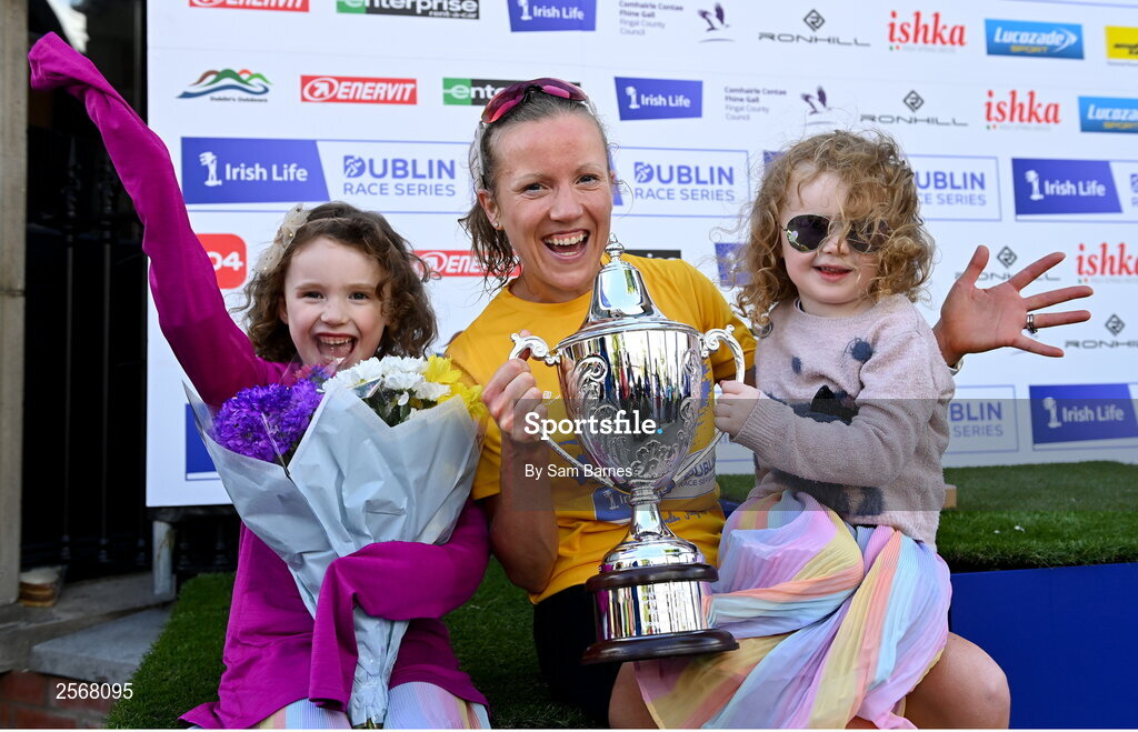 16 July 2023; Ciara Hickey of Brothers Pearse AC, Dublin, celebrates with her daughters Lilly, left, aged 6, and Annabel, aged 4, after winning the women's race during the 2023 Irish Life Dublin Race Series-Fingal 10km which took place on Sunday 16th of July at Swords in Dublin. Photo by Sam Barnes/Sportsfile