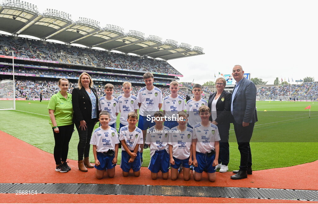 15 July 2023; The Monaghan team, back row, left to right, Tadgh Kelly, Newcestown NS, Bandon, Cork, Kevin Touhy, Kilgarvan Central School, Kilgarvan, Kerry, Russell Crowley, Laragh NS, Bandon, Cork, Ben O'Reilly, St. Mary's Boy's NS, Belturbet, Cavan, Jamie Irwin, Scoil Mhuire na mBuachaillí, Monaghan, front row, left to right, Thomas Kane, St Malachy's PS, Kilcoo, Down, Caolan Smith, St Oliver Plunkett's PS, Newry, Armagh, Jack McAnallen, Our Lady's PS, Benburb, Armagh, Max O Muineacháin, Gaelscoil Faithleann, Killarney, Kerry, Eanna McAuley, Mount Saint Michael's PS, Randalstown, Antrim, with GAA Safeguarding Officer Michelle Harte, LGFA Leinster President Trina Murray, Cumann na mBunscol President Mairéad O'Callaghan, and INTO CEO John Boyle, ahead of the INTO Cumann na mBunscol GAA Respect Exhibition Go Games at the GAA Football All-Ireland Senior Championship semi-final match between Dublin and Monaghan at Croke Park in Dublin. Photo by Daire Brennan/Sportsfile