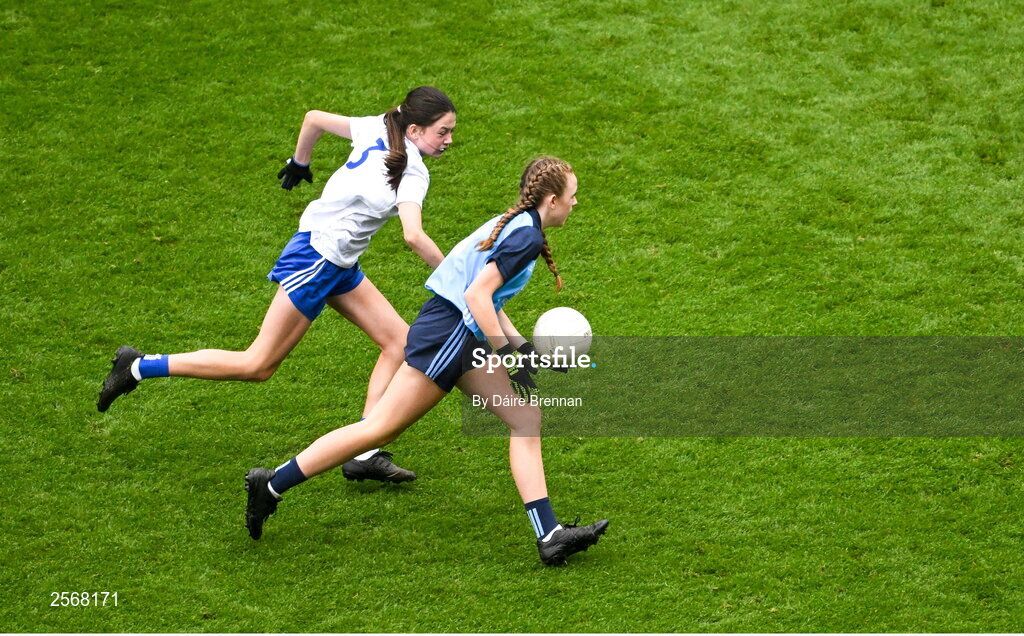 15 July 2023; Chloe Carey, Lisnagry NS, Lisnagry, Limerick, representing Dublin, in action Aoife Rodgers, St Brigid's NS, Bailieborough, Cavan, representing Monaghan, during the GAA Respect Exhibition Go Games at the GAA Football All-Ireland Senior Championship semi-final match between Dublin and Monaghan at Croke Park in Dublin. Photo by Daire Brennan/Sportsfile