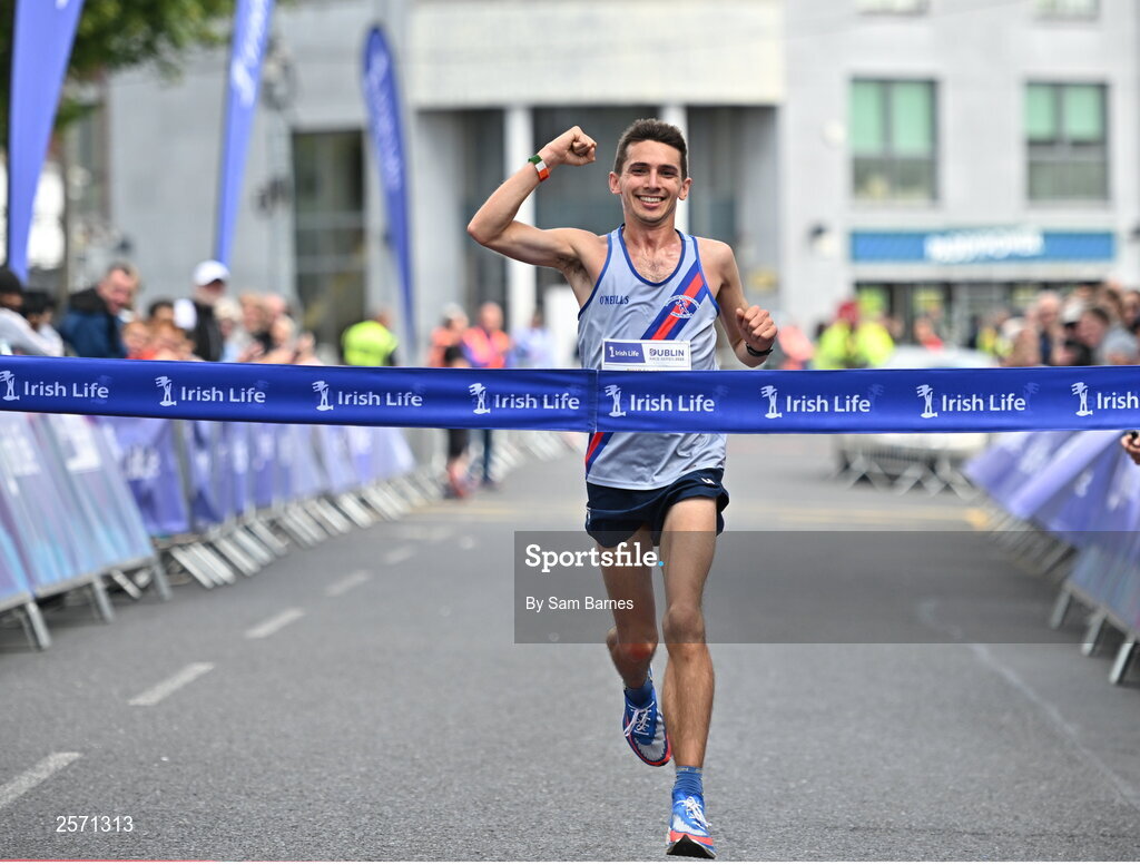 16 July 2023; Emmet Jennings of Dundrum South Dublin AC, crosses the line to win the 2023 Irish Life Dublin Race Series-Fingal 10km which took place on Sunday 16th of July at Swords in Dublin. Photo by Sam Barnes/Sportsfile