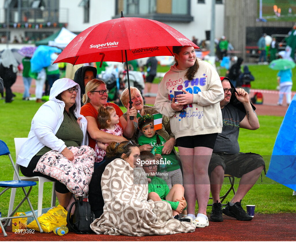 20 July 2023; Republic of Ireland supporters from The O'Rahilly House Flats, in Ringsend, take shelter from a shower during a Watch Party for the opening game of the 2023 FIFA Women's World Cup between Republic of Ireland and Australia at the Irishtown Sports & Fitness Centre in Ringsend, Dublin. Photo by Ray McManus/Sportsfile