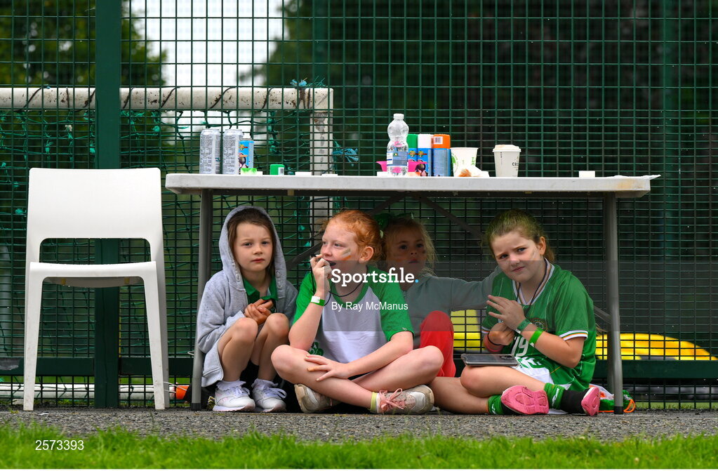 20 July 2023; Republic of Ireland supporters take shelter from a shower during a Watch Party for the opening game of the 2023 FIFA Women's World Cup between Republic of Ireland and Australia at the Irishtown Sports & Fitness Centre in Ringsend, Dublin. Photo by Ray McManus/Sportsfile