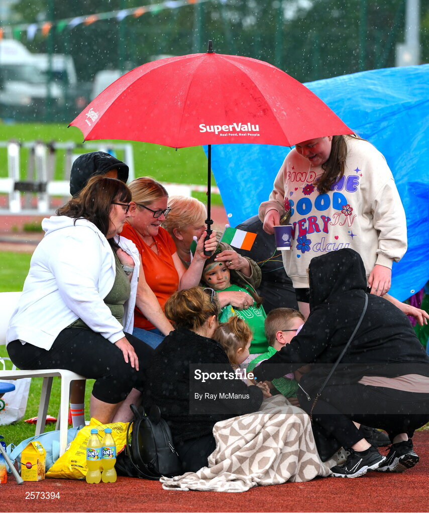 20 July 2023; Republic of Ireland supporters from The O'Rahilly House Flats, in Ringsend, take shelter from a shower during a Watch Party for the opening game of the 2023 FIFA Women's World Cup between Republic of Ireland and Australia at the Irishtown Sports & Fitness Centre in Ringsend, Dublin. Photo by Ray McManus/Sportsfile