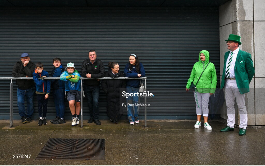 23 July 2023; Supporters take shelter from the rain before going in for the GAA Hurling All-Ireland Senior Championship final match between Kilkenny and Limerick at Croke Park in Dublin. Photo by Ray McManus/Sportsfile