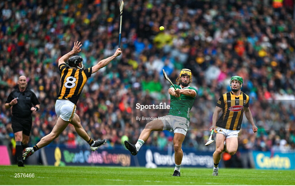 23 July 2023; Tom Morrissey of Limerick scores a point despite the efforts of Conor Fogarty of Kilkenny during the GAA Hurling All-Ireland Senior Championship final match between Kilkenny and Limerick at Croke Park in Dublin. Photo by Brendan Moran/Sportsfile