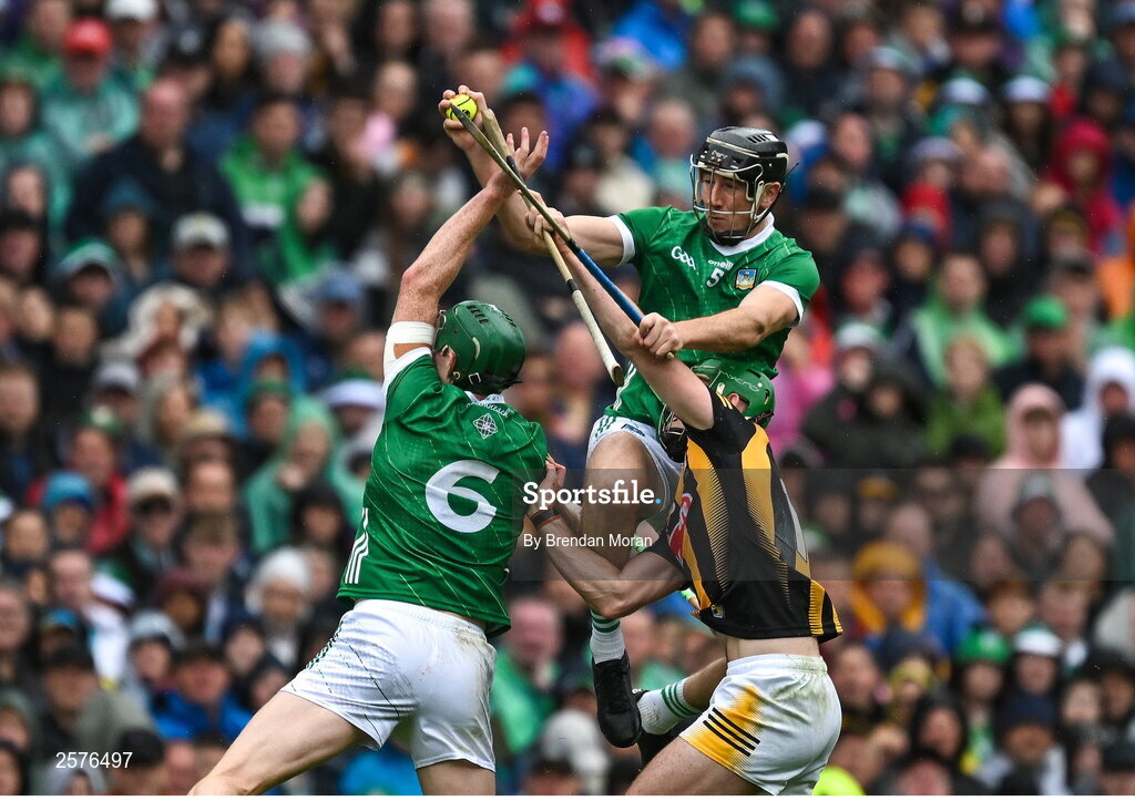 23 July 2023; Diarmaid Byrnes of Limerick catches the sliotar ahead of teamate William O'Donoghue and Eoin Cody of Kilkenny during the GAA Hurling All-Ireland Senior Championship final match between Kilkenny and Limerick at Croke Park in Dublin. Photo by Brendan Moran/Sportsfile