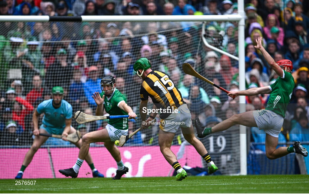 23 July 2023; Eoin Cody of Kilkenny scores his side's first goal despite the efforts of Limerick players Diarmaid Byrnes and Barry Nash during the GAA Hurling All-Ireland Senior Championship final match between Kilkenny and Limerick at Croke Park in Dublin. Photo by Piaras Ó Mídheach/Sportsfile
