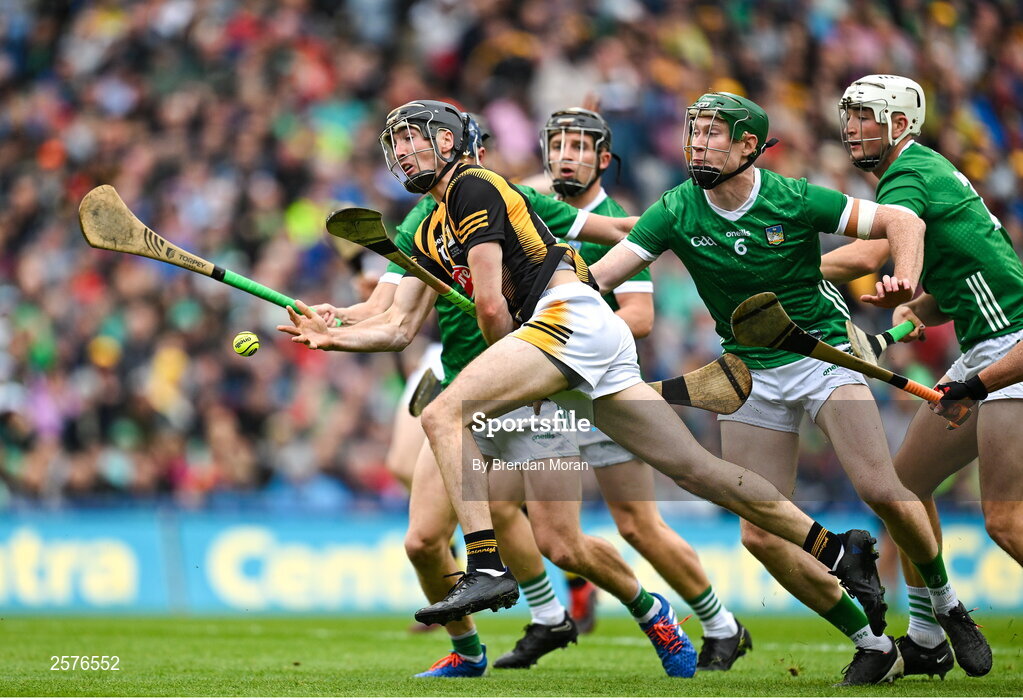 23 July 2023; Tom Phelan of Kilkenny lays on the pass to help score their side's second goal despite the tackles of Limerick players, from left, David Reidy, William O'Donoghue and Kyle Hayes during the GAA Hurling All-Ireland Senior Championship final match between Kilkenny and Limerick at Croke Park in Dublin. Photo by Brendan Moran/Sportsfile