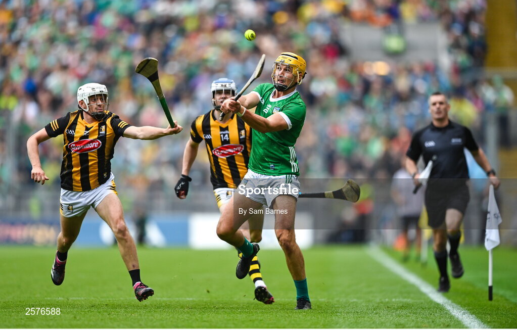 23 July 2023; Cathal O'Neill of Limerick scores a point despite the efforts of Cian Kenny, left, and TJ Reid of Kilkenny during the GAA Hurling All-Ireland Senior Championship final match between Kilkenny and Limerick at Croke Park in Dublin. Photo by Sam Barnes/Sportsfile