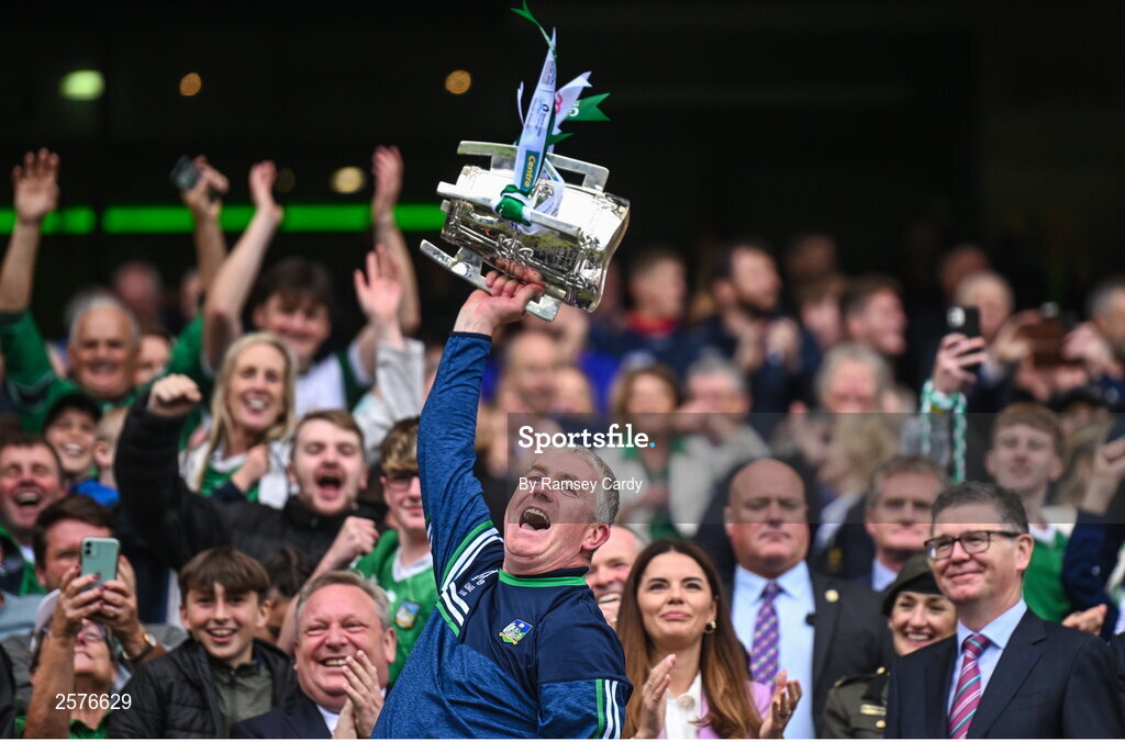 23 July 2023; Limerick manager John Kiely lifts the Liam MacCarthy Cup after his side's victory in the GAA Hurling All-Ireland Senior Championship final match between Kilkenny and Limerick at Croke Park in Dublin. Photo by Ramsey Cardy/Sportsfile
