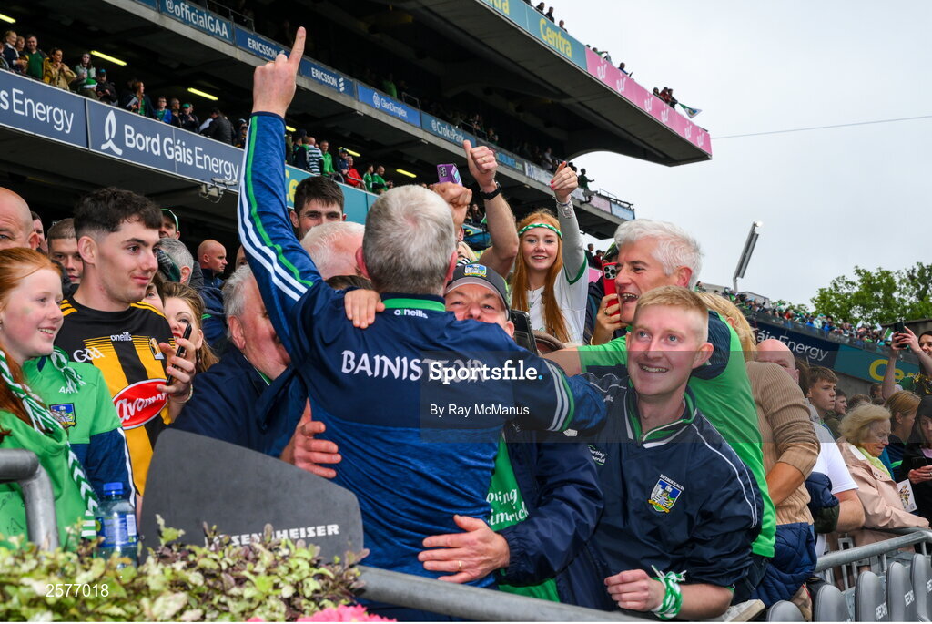 23 July 2023; Limerick manager John Kiely is congratulated as he walks up the steps to raise the Liam MacCarthy Cup after the GAA Hurling All-Ireland Senior Championship final match between Kilkenny and Limerick at Croke Park in Dublin. Photo by Ray McManus/Sportsfile