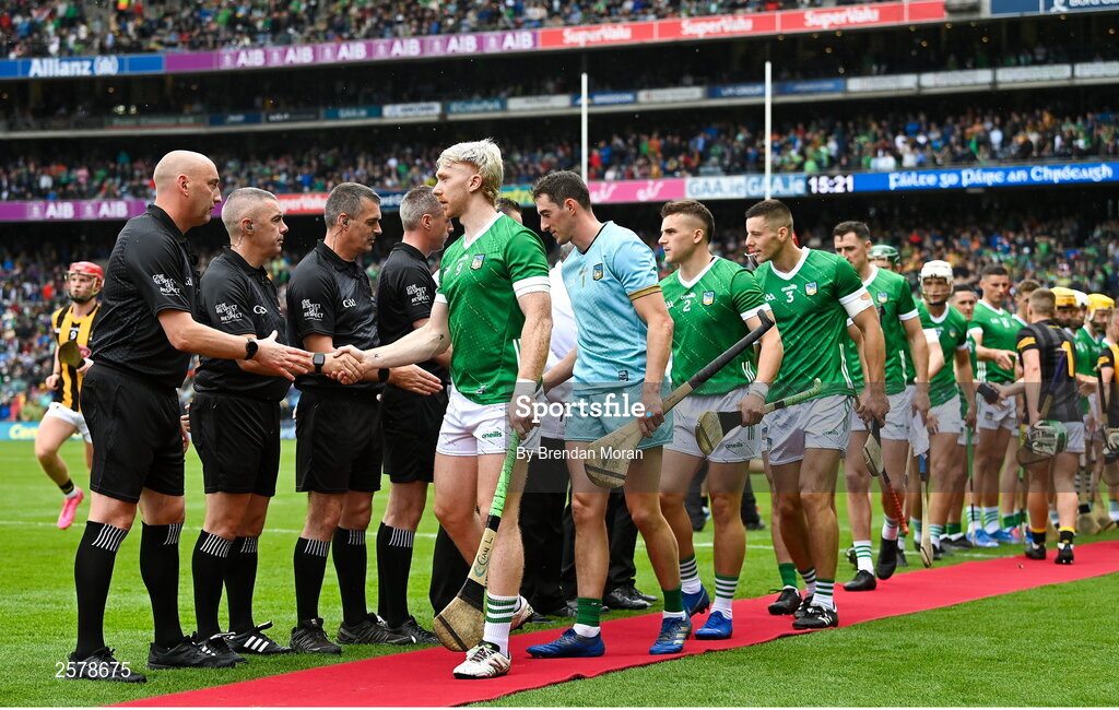 23 July 2023; Limerick captain Cian Lynch shakes hands with the match officials before the GAA Hurling All-Ireland Senior Championship final match between Kilkenny and Limerick at Croke Park in Dublin. Photo by Brendan Moran/Sportsfile