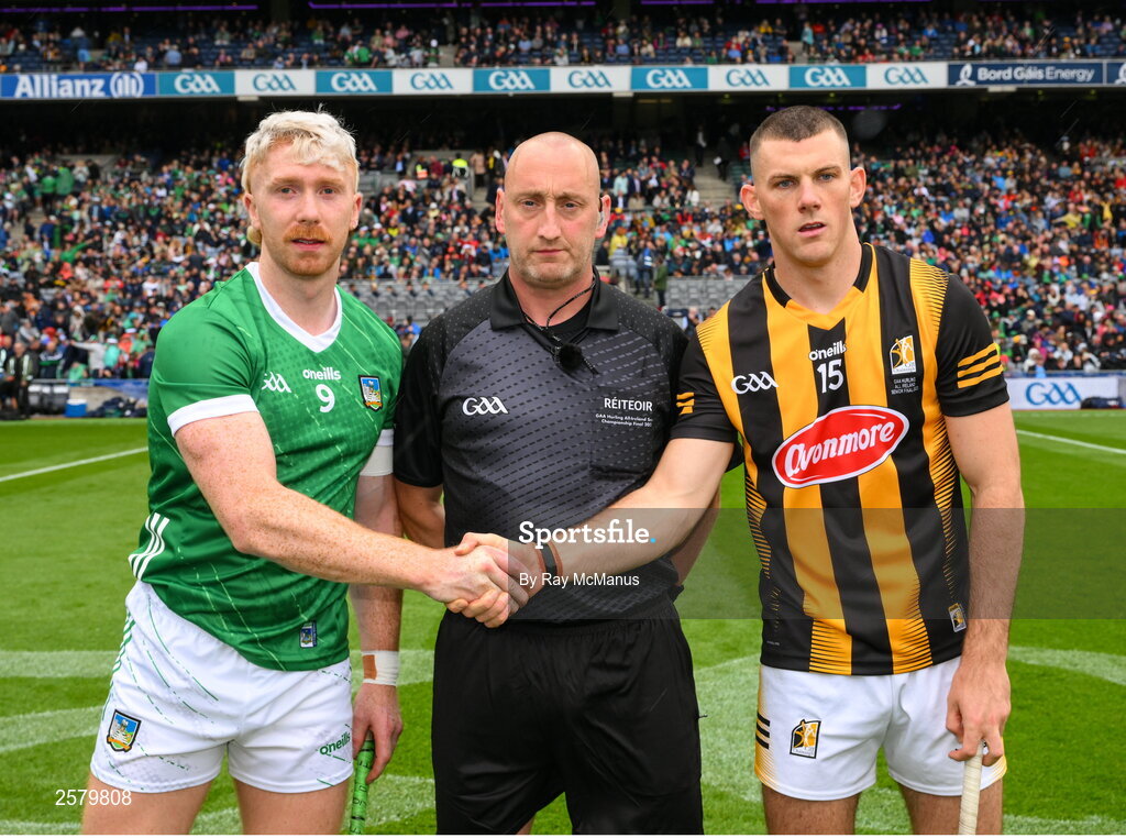23 July 2023; The two captains, Cian Lynch of Limerick, and Eoin Cody of Kilkenny, shake hands across match referee John Keenan before the GAA Hurling All-Ireland Senior Championship final match between Kilkenny and Limerick at Croke Park in Dublin. Photo by Ray McManus/Sportsfile