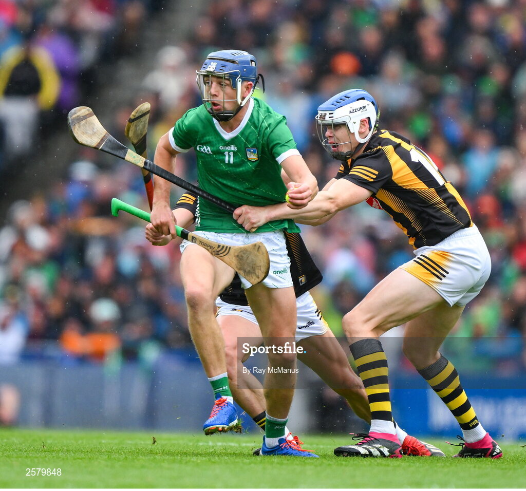 23 July 2023; David Reidy of Limerick is tackled by TJ Reid and Richie Reid of Kilkenny, hidden, during the GAA Hurling All-Ireland Senior Championship final match between Kilkenny and Limerick at Croke Park in Dublin. Photo by Ray McManus/Sportsfile