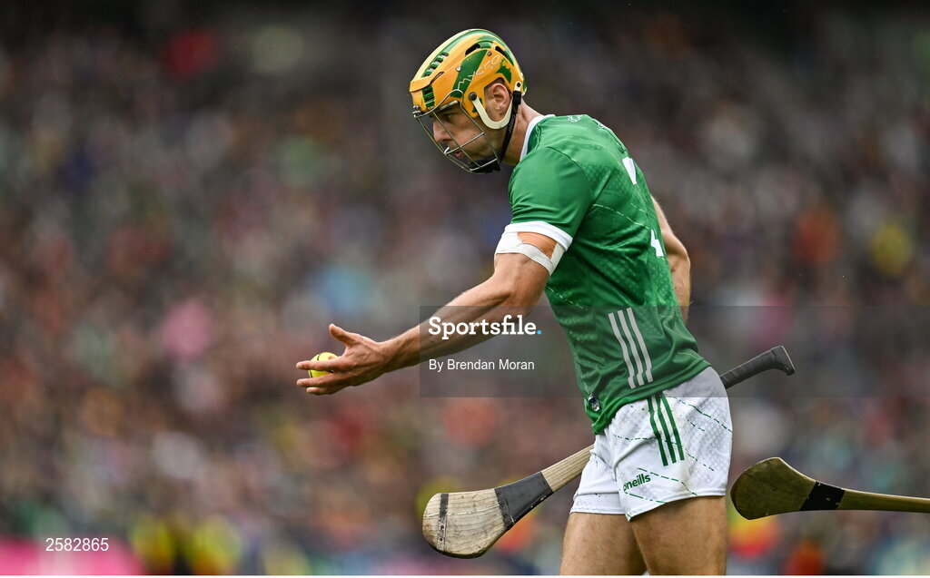 23 July 2023; Dan Morrissey of Limerick handpasses the sliotar during the GAA Hurling All-Ireland Senior Championship final match between Kilkenny and Limerick at Croke Park in Dublin. Photo by Brendan Moran/Sportsfile