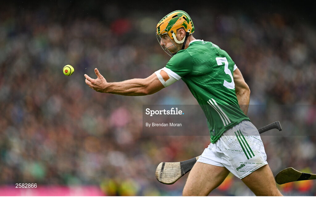 23 July 2023; Dan Morrissey of Limerick handpasses the sliotar during the GAA Hurling All-Ireland Senior Championship final match between Kilkenny and Limerick at Croke Park in Dublin. Photo by Brendan Moran/Sportsfile