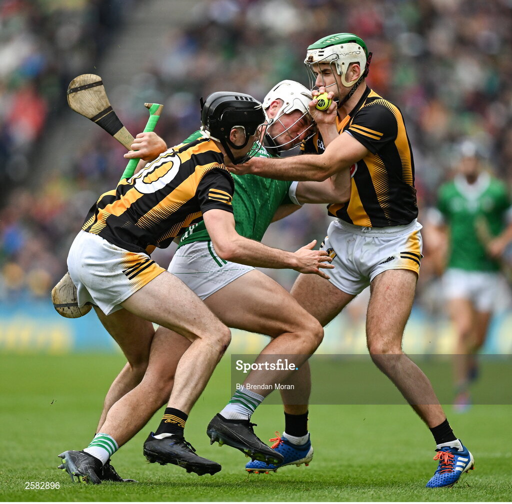 23 July 2023; Kyle Hayes of Limerick is tackled by Tom Phelan, left, and Paddy Deegan of Kilkenny during the GAA Hurling All-Ireland Senior Championship final match between Kilkenny and Limerick at Croke Park in Dublin. Photo by Brendan Moran/Sportsfile