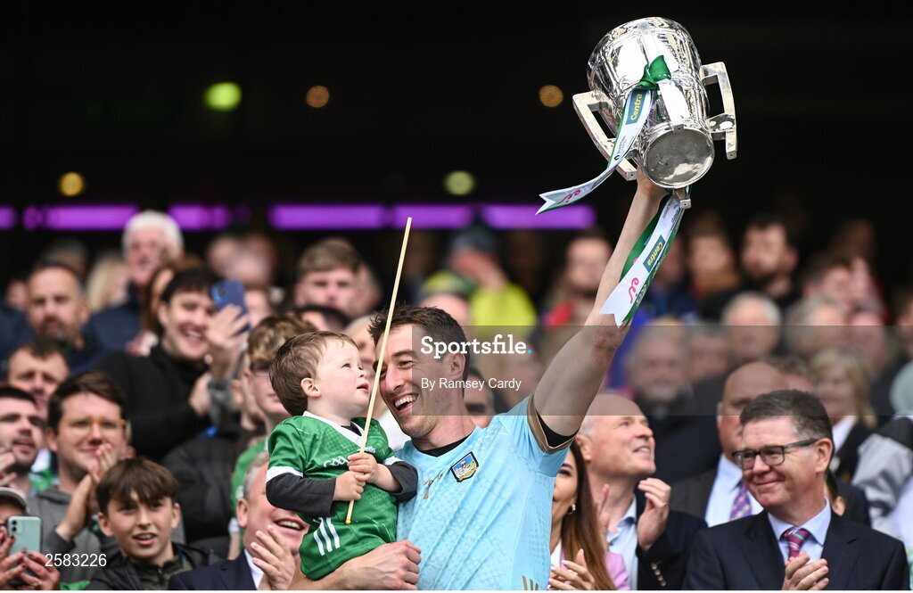23 July 2023; Limerick goalkeeper Nickie Quaid, with his son Dáithí, lifts the Liam MacCarthy Cup after the GAA Hurling All-Ireland Senior Championship final match between Kilkenny and Limerick at Croke Park in Dublin. Photo by Ramsey Cardy/Sportsfile