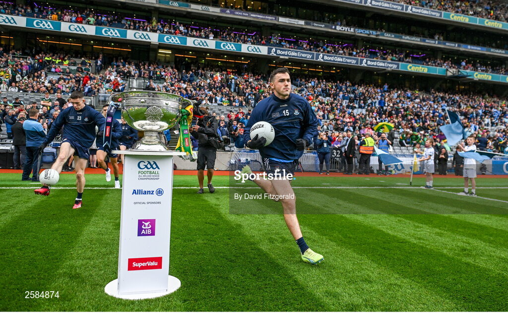 30 July 2023; Colm Basquel of Dublin runs past the Sam Maguire cup before the GAA Football All-Ireland Senior Championship final match between Dublin and Kerry at Croke Park in Dublin. Photo by David Fitzgerald/Sportsfile