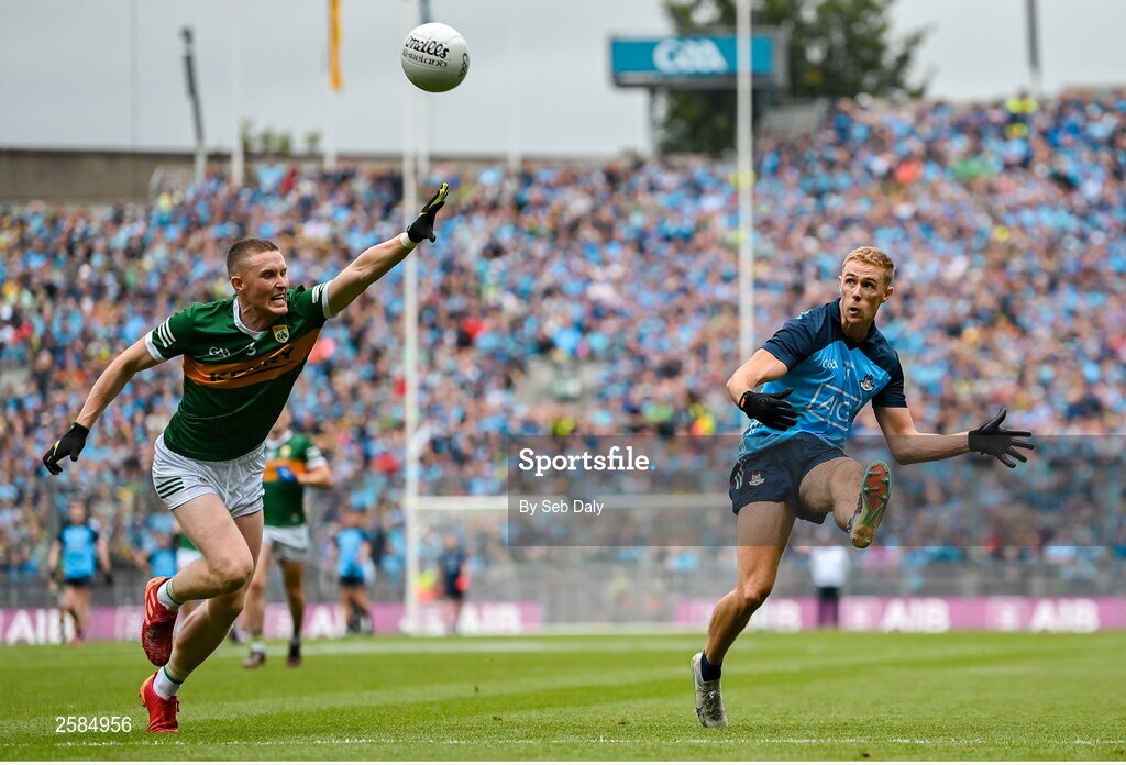 30 July 2023; Paul Mannion of Dublin kicks a point, under pressure from Kerry's Jason Foley, during the GAA Football All-Ireland Senior Championship final match between Dublin and Kerry at Croke Park in Dublin. Photo by Seb Daly/Sportsfile