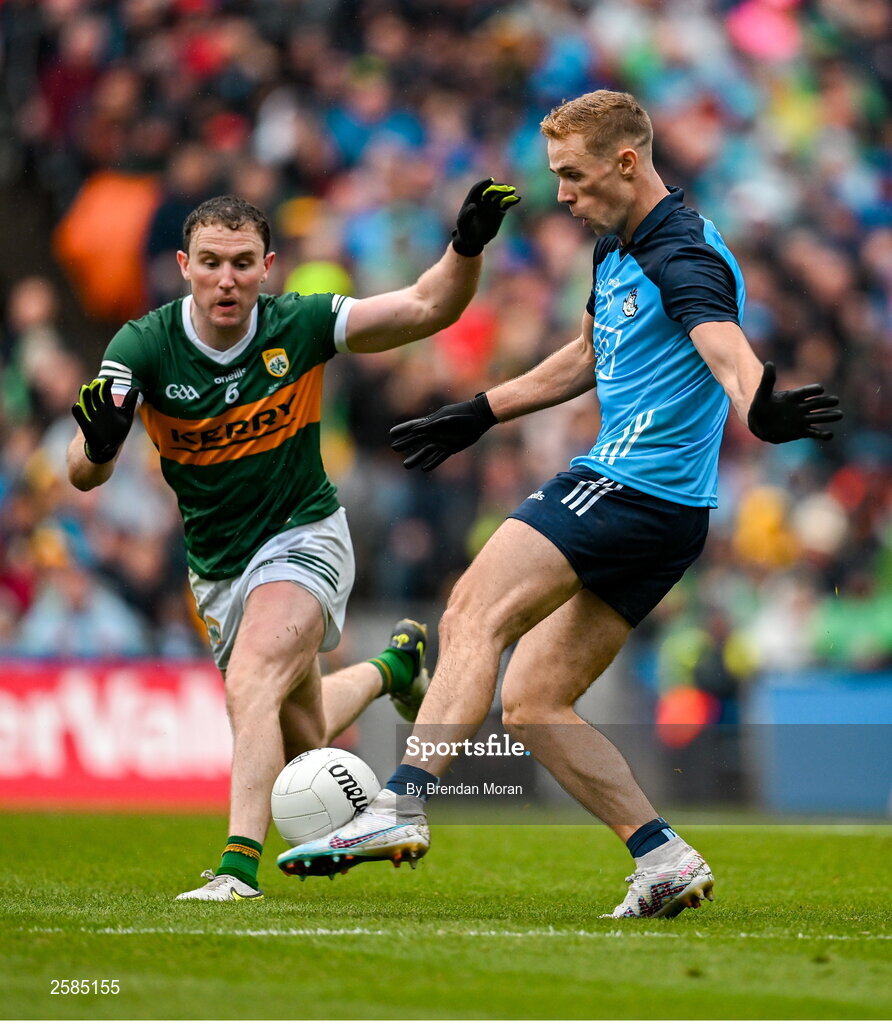 30 July 2023; Paul Mannion of Dublin kicks a point despite the efforts of Tadhg Morley of Kerry to give Dublin the lead in the 74th minute during the GAA Football All-Ireland Senior Championship final match between Dublin and Kerry at Croke Park in Dublin. Photo by Brendan Moran/Sportsfile