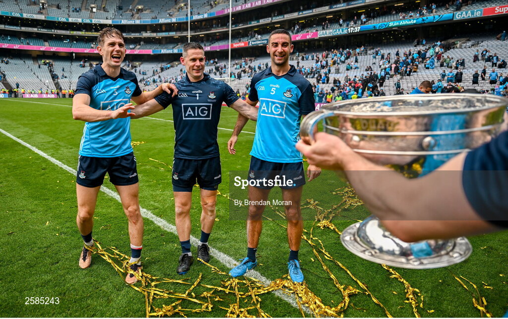 30 July 2023; Dublin players and record 9 time All-Ireland winning medallists, from left, captain James McCarthy, Stephen Cluxton and Michael Fitzsimons celebrate with the Sam Maguire Cup after the GAA Football All-Ireland Senior Championship final match between Dublin and Kerry at Croke Park in Dublin. Photo by Brendan Moran/Sportsfile