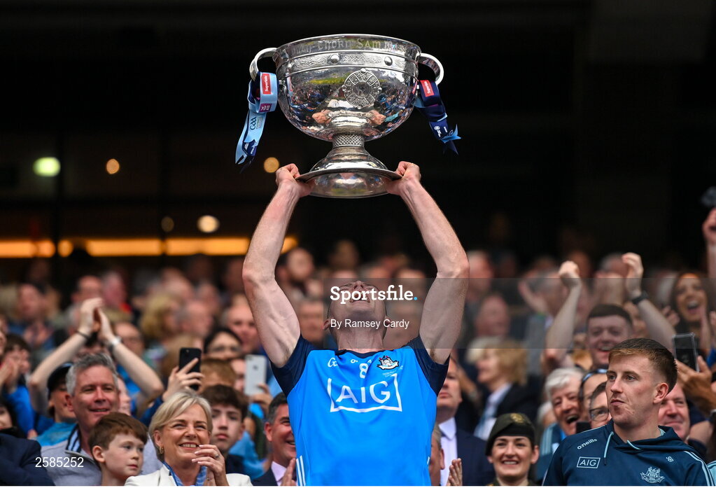 30 July 2023; Brian Fenton of Dublin lifts the Sam Maguire cup after the GAA Football All-Ireland Senior Championship final match between Dublin and Kerry at Croke Park in Dublin. Photo by Ramsey Cardy/Sportsfile