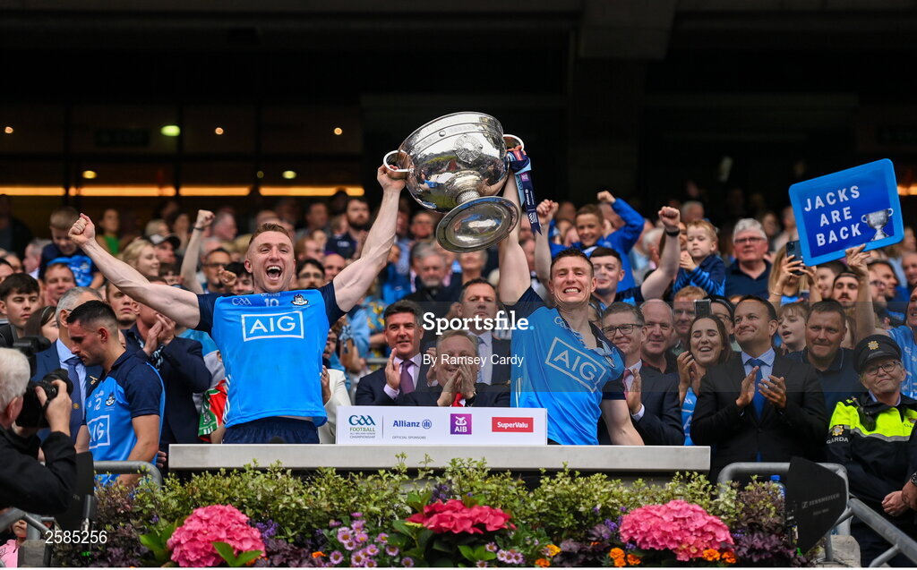 30 July 2023; Paddy Small, left, and John Small of Dublin lift the Sam Maguire cup after the GAA Football All-Ireland Senior Championship final match between Dublin and Kerry at Croke Park in Dublin. Photo by Ramsey Cardy/Sportsfile