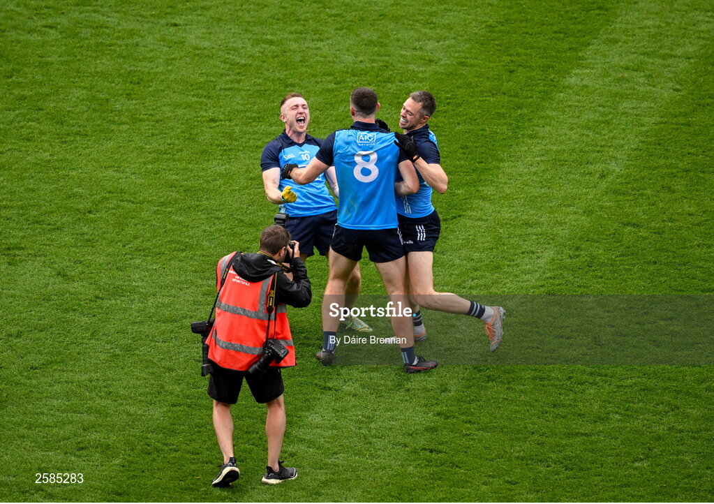 30 July 2023; Dublin players, left to right, Paddy Small, Brian Fenton, and Dean Rock, celebrate after the GAA Football All-Ireland Senior Championship final match between Dublin and Kerry at Croke Park in Dublin. Photo by Daire Brennan/Sportsfile