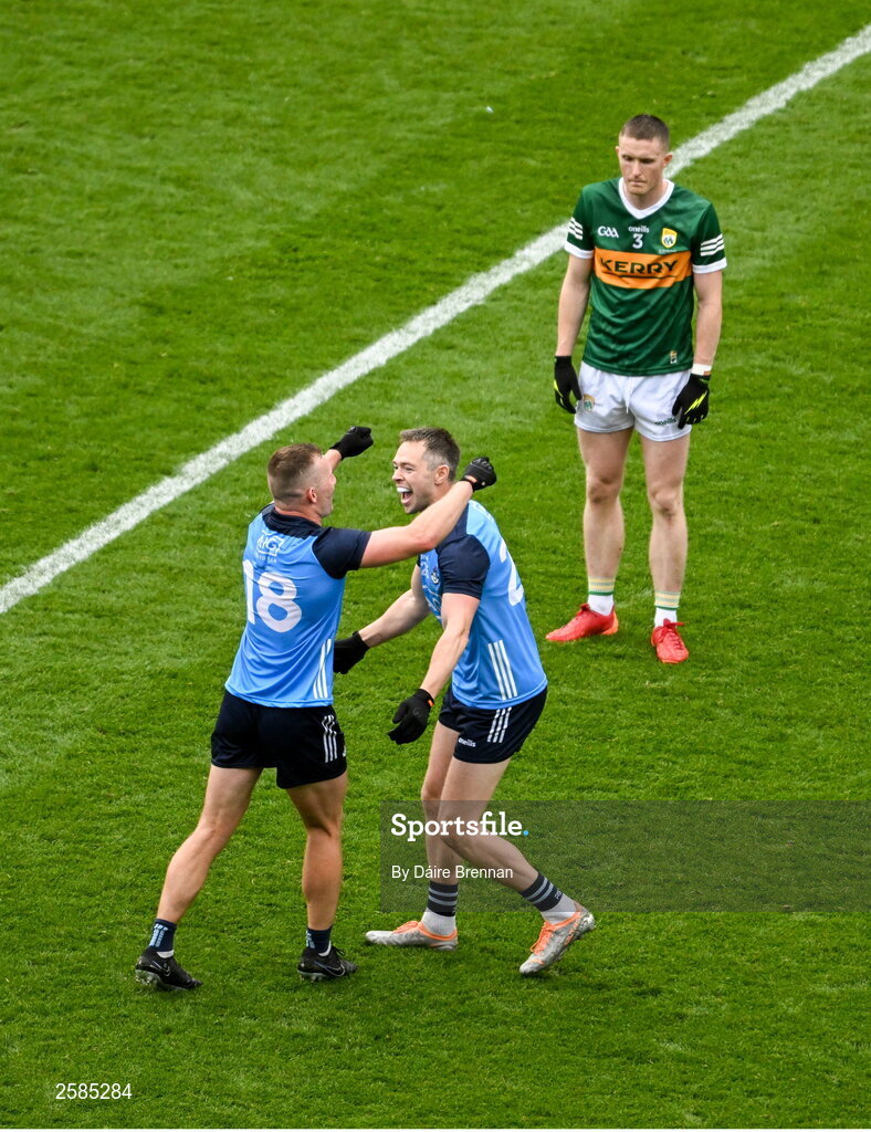 30 July 2023; Dublin players, Ciaran Kilkenny, left, and Dean Rock, celebrate, near a dejected Jason Foley of Kerry after the GAA Football All-Ireland Senior Championship final match between Dublin and Kerry at Croke Park in Dublin. Photo by Daire Brennan/Sportsfile