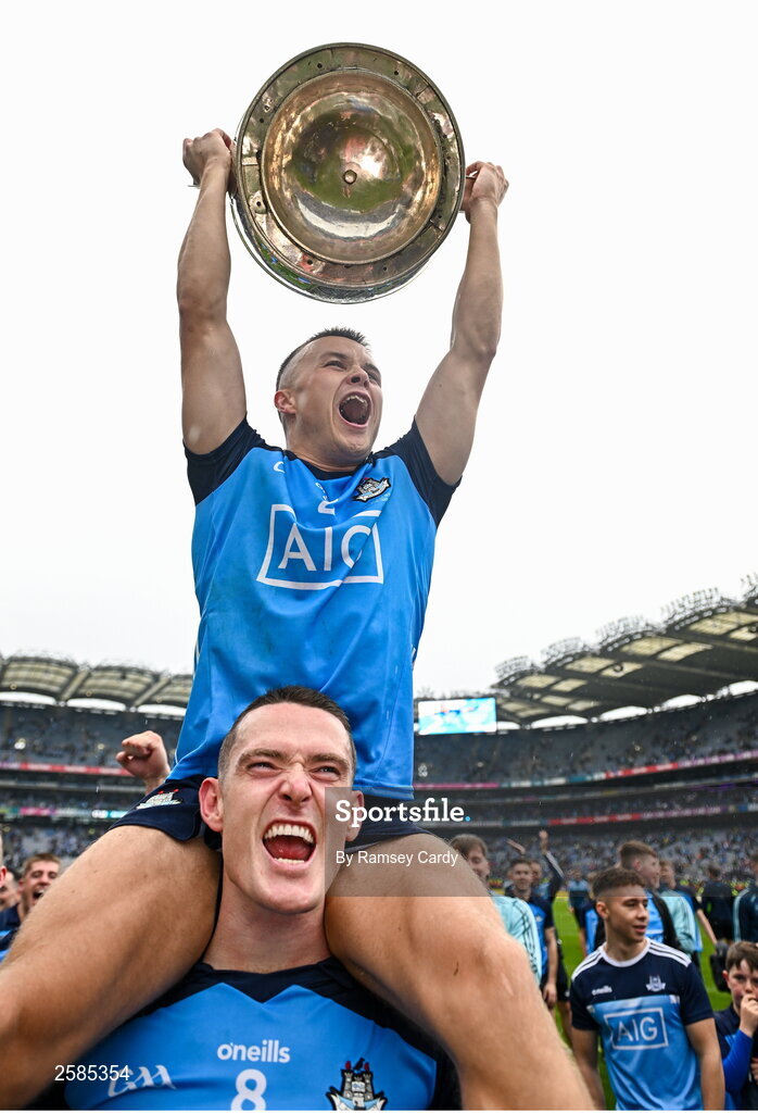 30 July 2023; Eoin Murchan, with the Sam Maguire cup, is held aloft by Brian Fenton of Dublin after the GAA Football All-Ireland Senior Championship final match between Dublin and Kerry at Croke Park in Dublin. Photo by Ramsey Cardy/Sportsfile