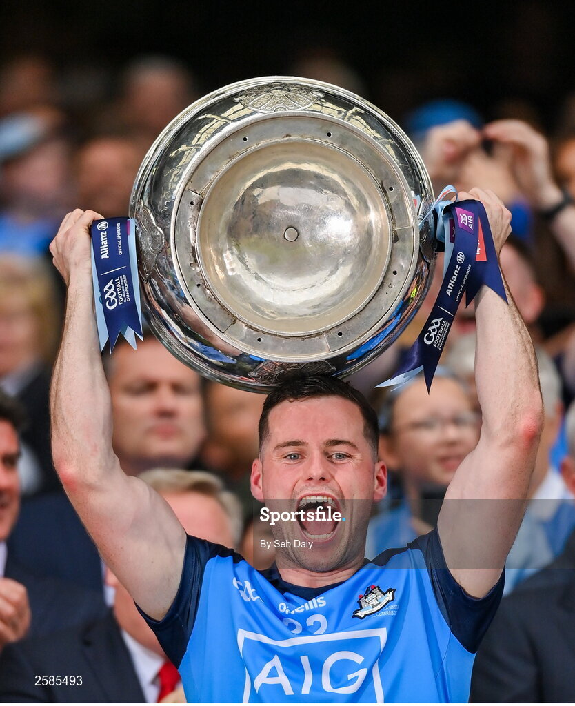 30 July 2023; Ross McGarry of Dublin lifts the Sam Maguire Cup after his side's victory in the GAA Football All-Ireland Senior Championship final match between Dublin and Kerry at Croke Park in Dublin. Photo by Seb Daly/Sportsfile