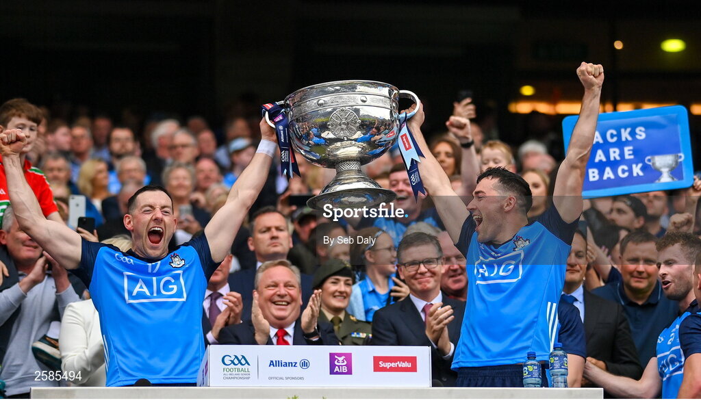 30 July 2023; Dublin players Ryan Basquel, left, and Colm Basquel lift the Sam Maguire Cup after their side's victory in the GAA Football All-Ireland Senior Championship final match between Dublin and Kerry at Croke Park in Dublin. Photo by Seb Daly/Sportsfile