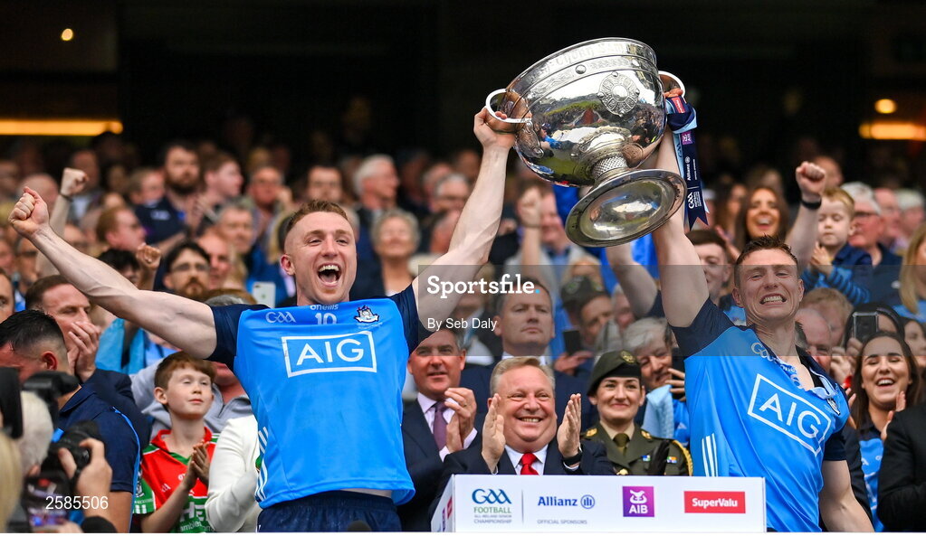 30 July 2023; Dublin players Paddy Small, left, and John Small lift the Sam Maguire Cup after their side's victory in the GAA Football All-Ireland Senior Championship final match between Dublin and Kerry at Croke Park in Dublin. Photo by Seb Daly/Sportsfile