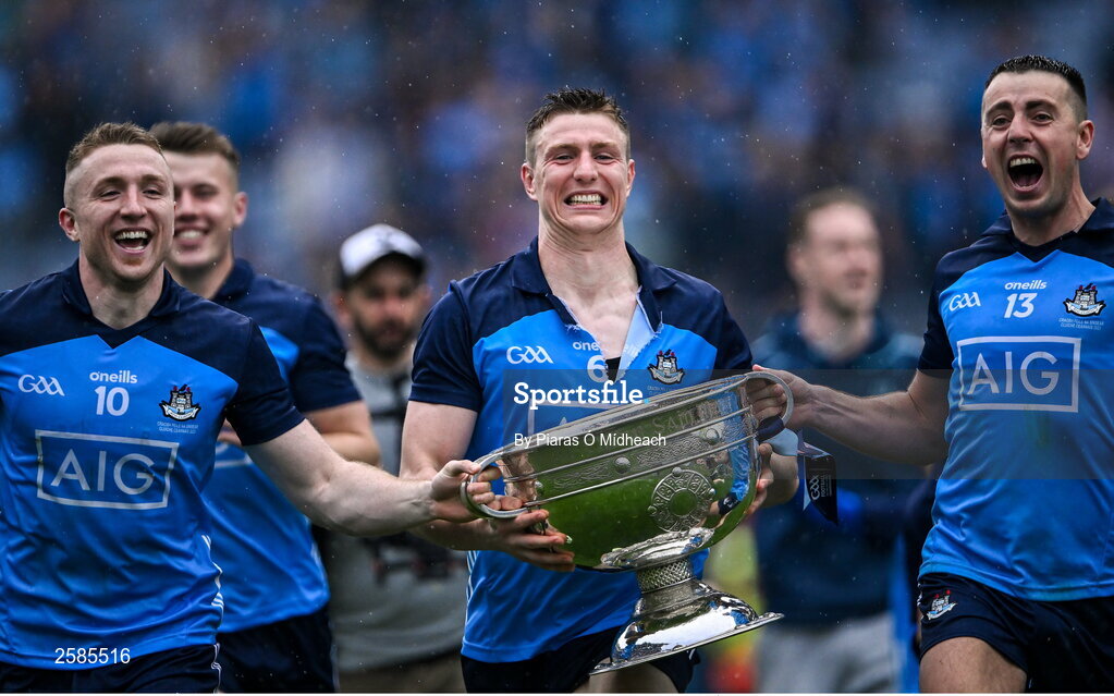 30 July 2023; Dublin players Paddy Small, 10, John Small and Cormac Costello, 13, celebrate with the Sam Maguire Cup after their side's victory in the GAA Football All-Ireland Senior Championship final match between Dublin and Kerry at Croke Park in Dublin. Photo by Piaras Ó Mídheach/Sportsfile